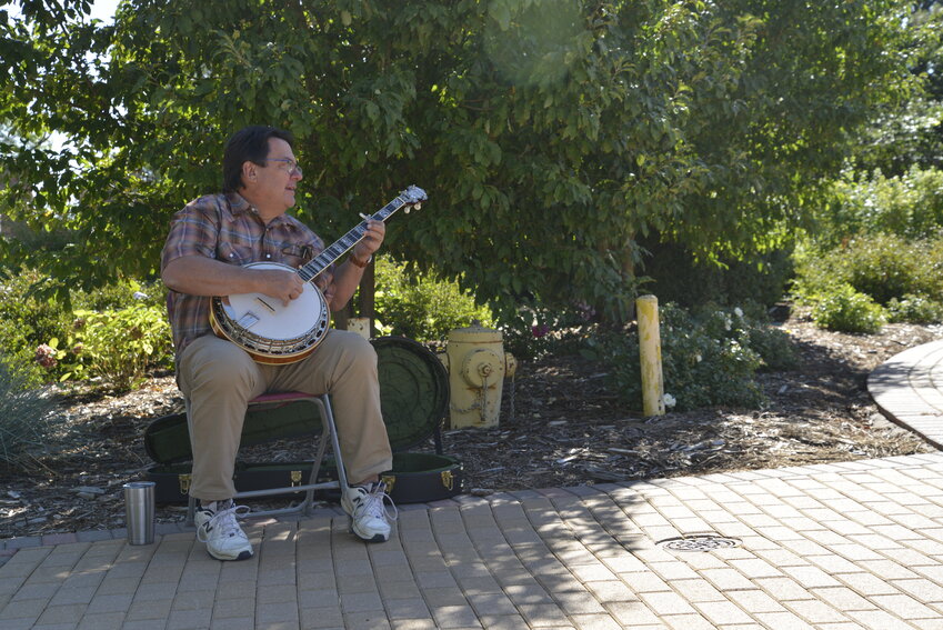 Frank Okoren plays the banjo during the two-day Pioneer Days event at the Highlands Ranch Mansion. Okoren embraces the freedom the day brings him.